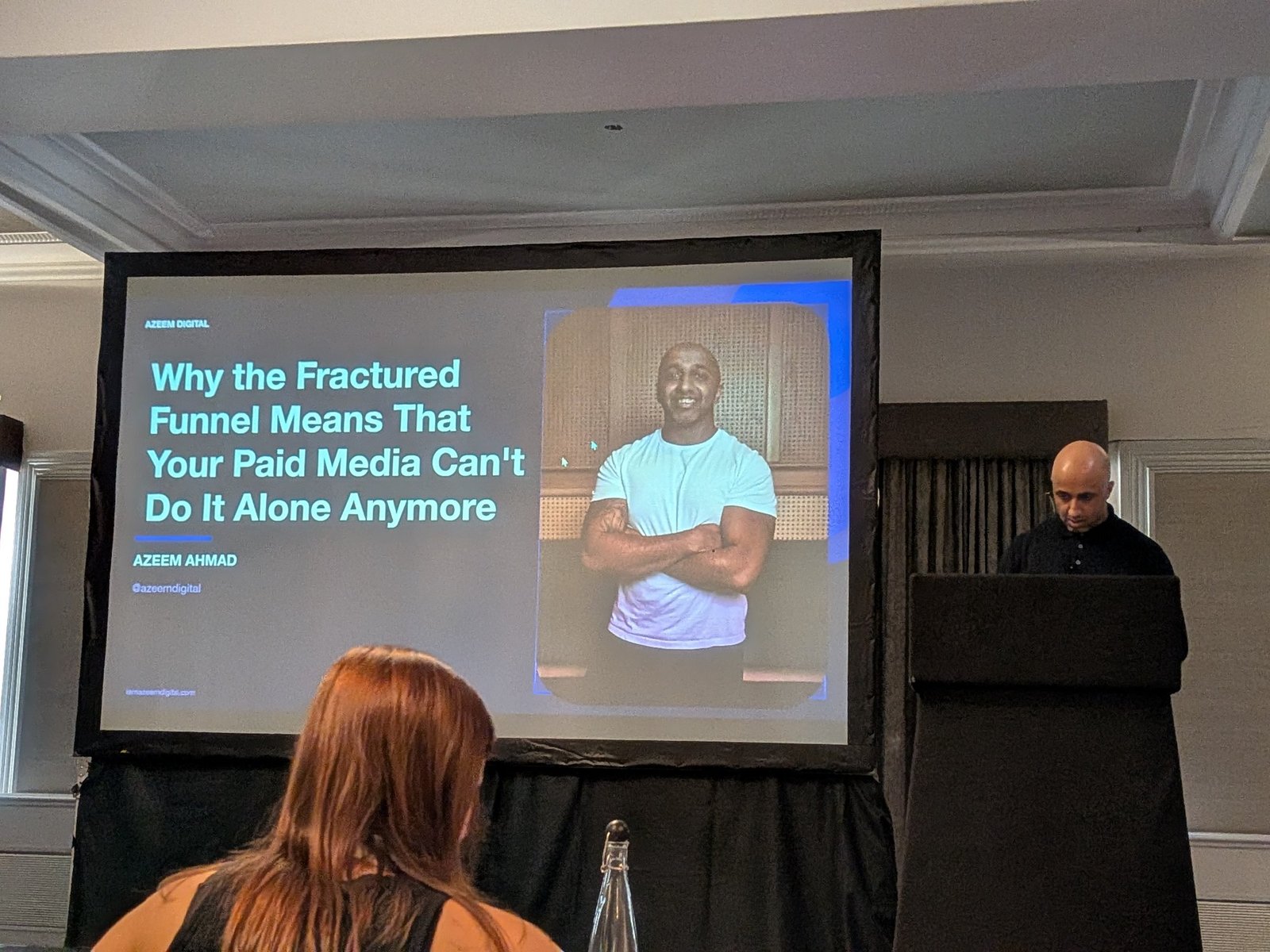 Title slide with Azeem Ahmad at the podium