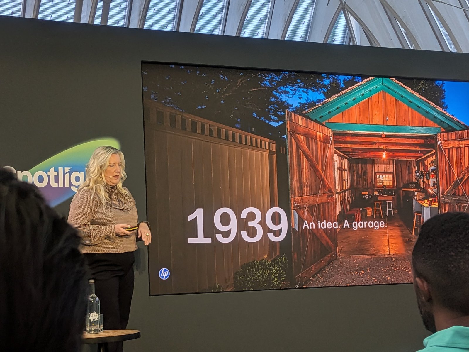 Carmen True of HP presenting at Spotlight 2026 with a slide of the original 1939 HP garage